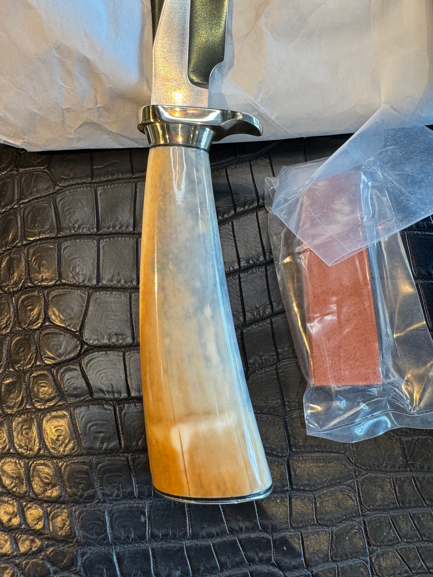 News in Paper Randall Model 8-4 in a gorgeous piece of Cream and Blue Fossil Walrus Ivory. Nickel Silver single hilt with a nickel Collar and butt cap.