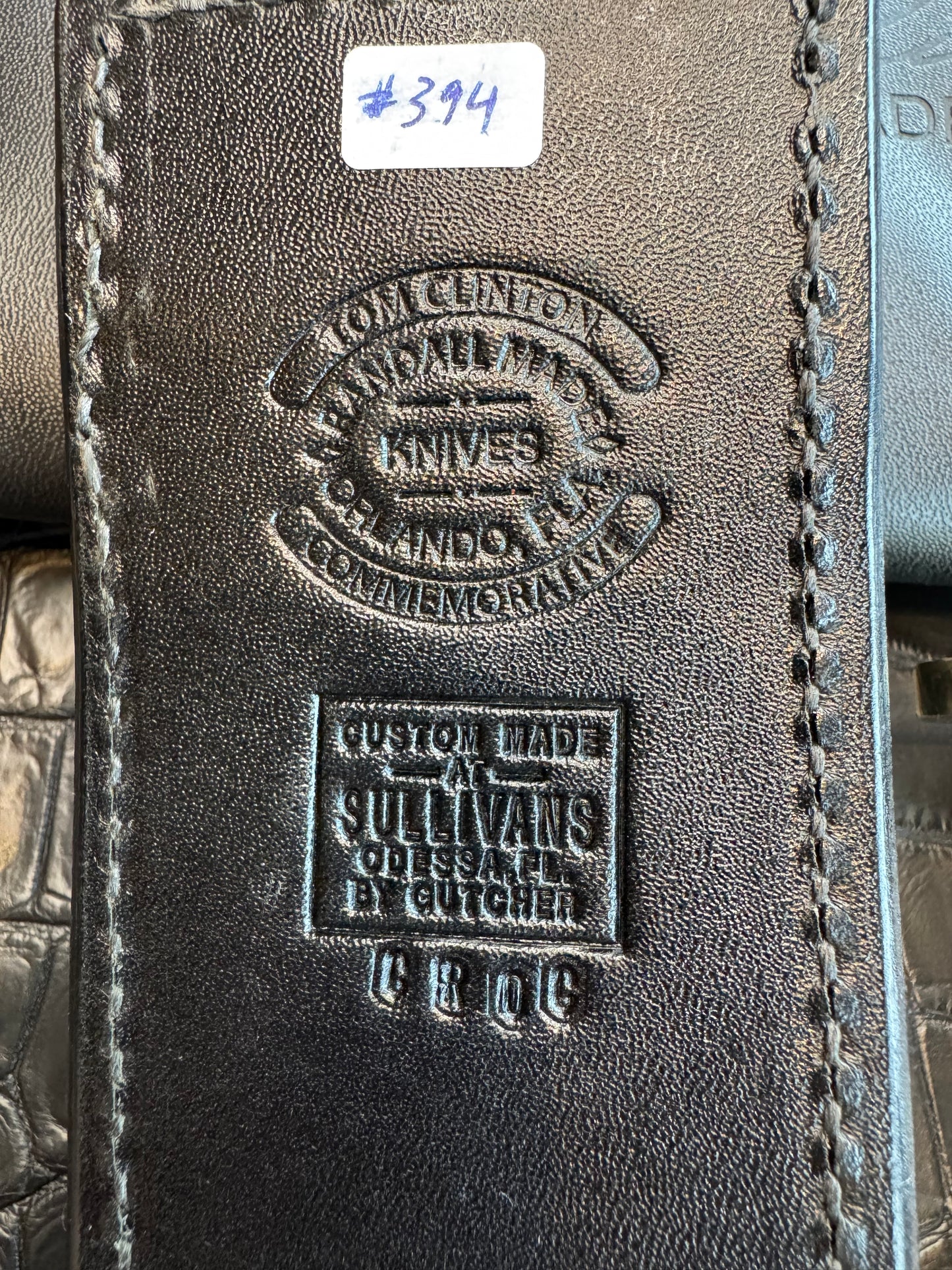 Randall Tom Clinton Dealer Special. Clinton Blade etched Commemorative 1/100 in a nice piece of finger grooved Ivorite. Very cool Black Crocodile skull Gutcher sheath. Nickel Silver Hilt. Included in black facsimile Tom Clinton case.