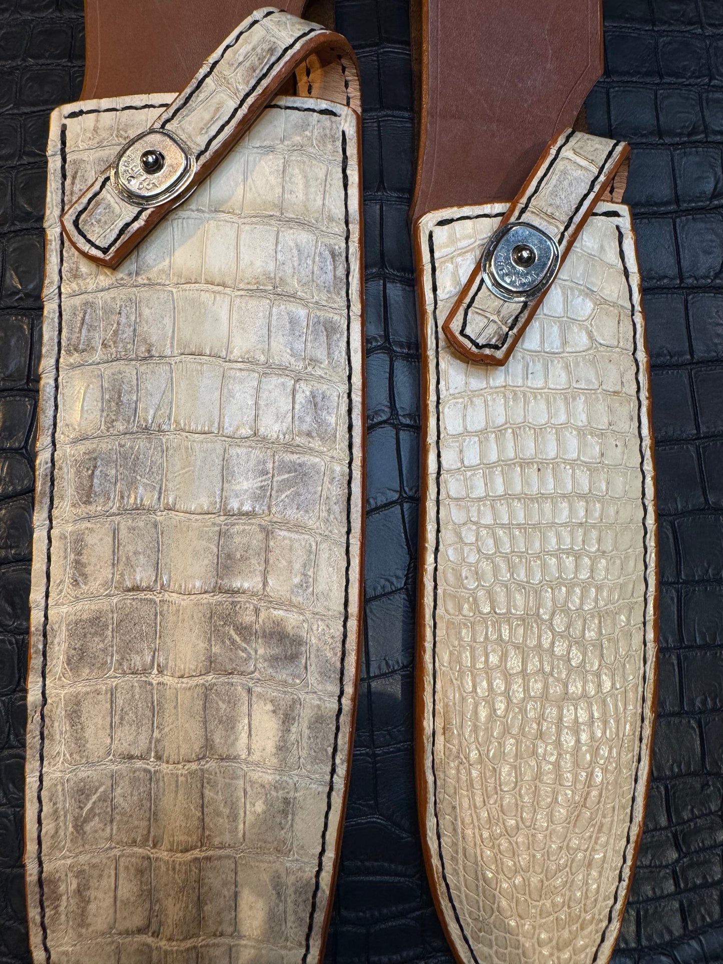 A pair of Randall Model 12-11 Large Sasquatch and Randall Model 12-8 Small Sasquatch Sheaths in Exotic Ivory Crocodile by Treeman.