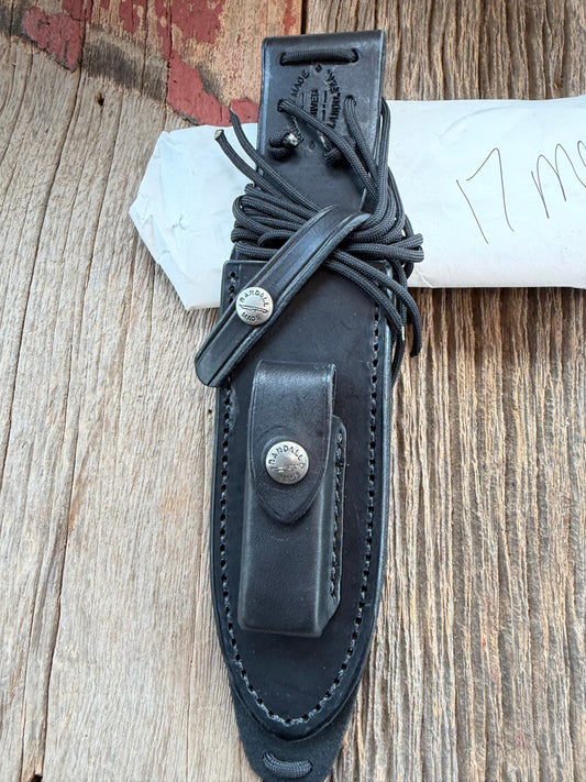 New in Paper Randall Model 17-5.5 Astro knife is a custom, handmade combat knife with a 5.5" stainless steel clip point blade and a brown leather sheath. Full tang design, black handle.