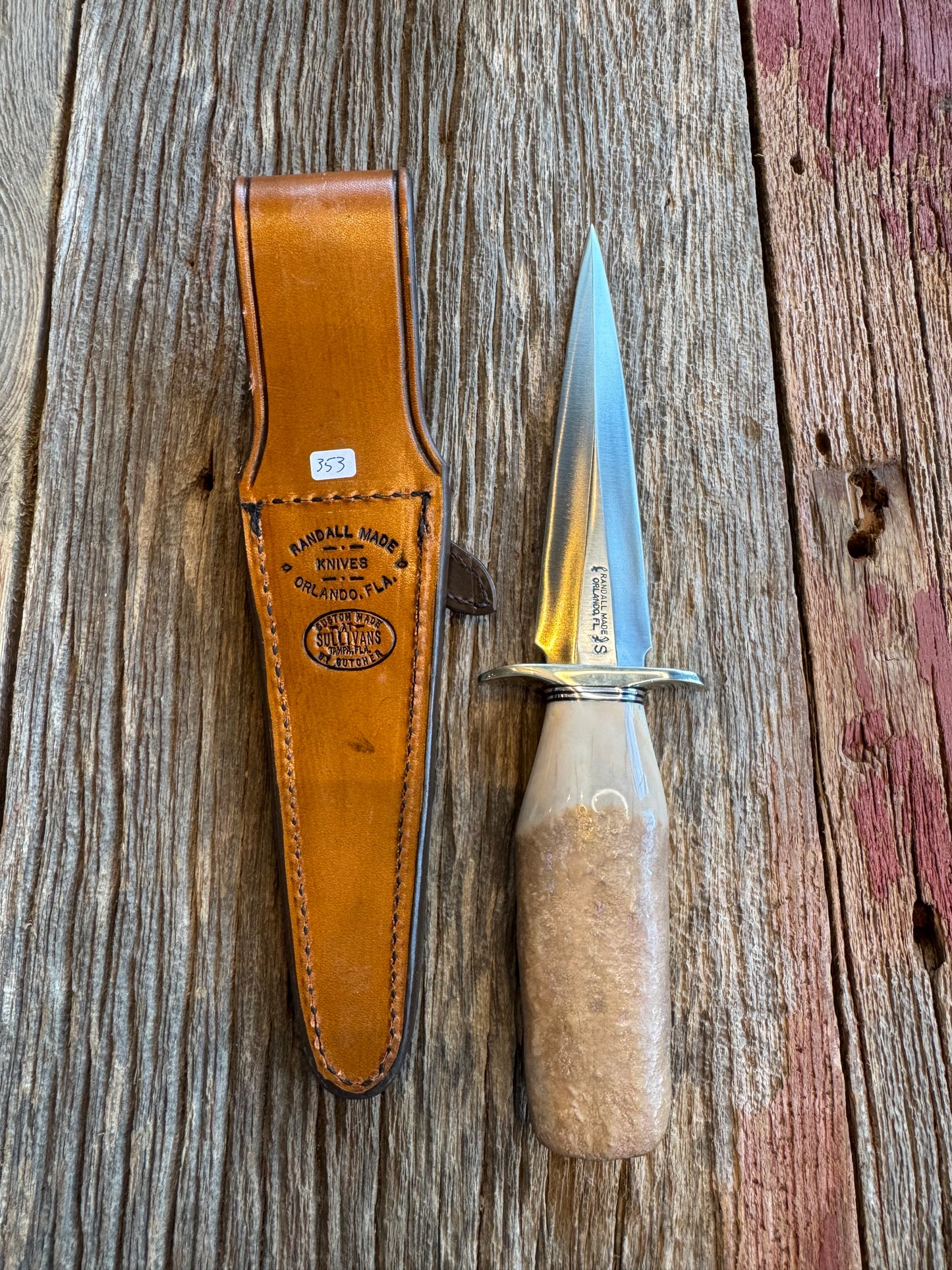 Randall Knife Model 13-6 Small Arkansas Toothpick Artifact. Fossil Walrus in an Ice Ax Handle. Included is a very rare Gutcher Rattlesnake sheath, Stainless Steel.