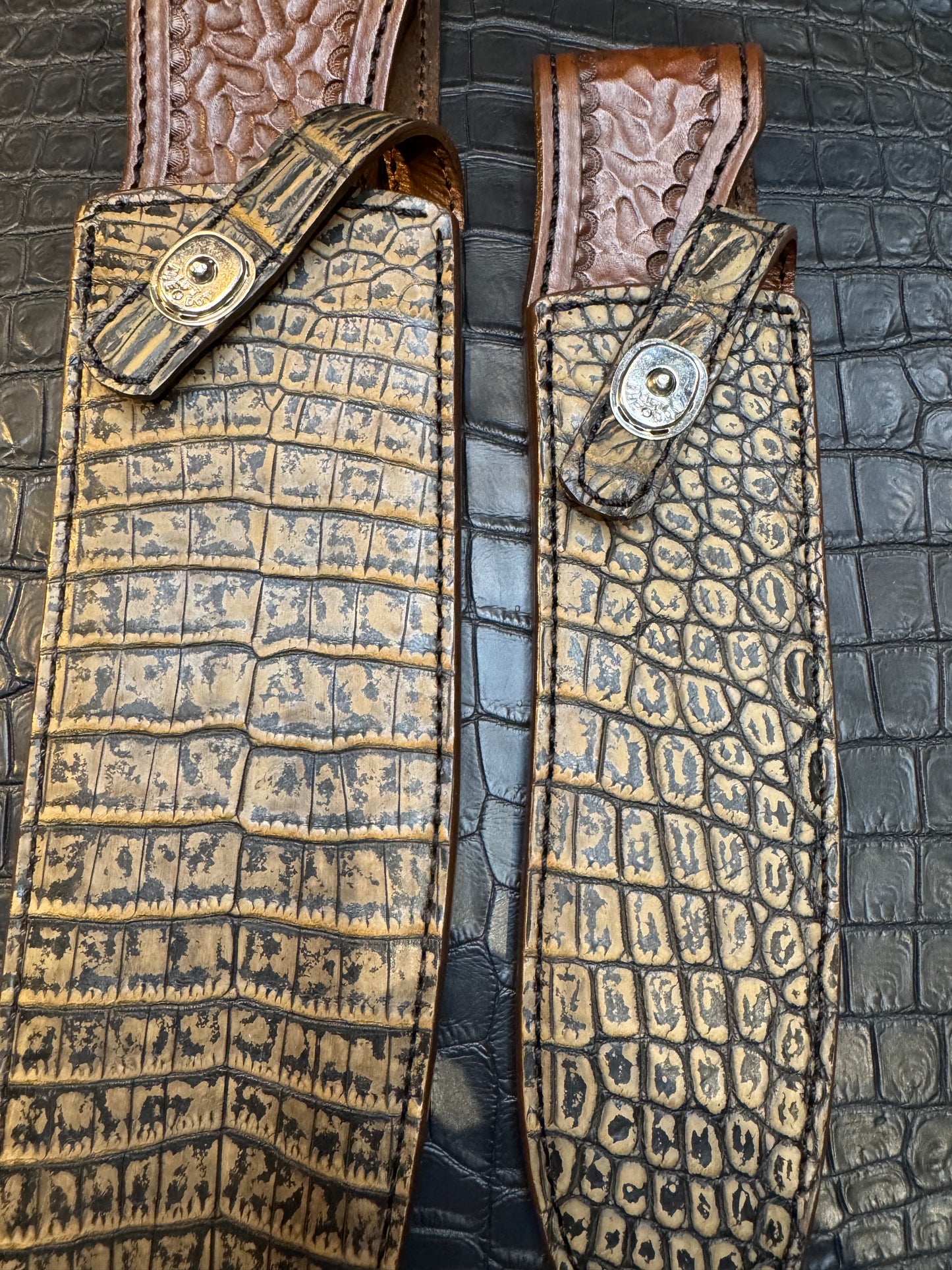A pair of Randall Model 12-11 Large Sasquatch and Randall Model 12-8 Small Sasquatch Sheaths in Exotic Antique Brown Crocodile by Treeman.