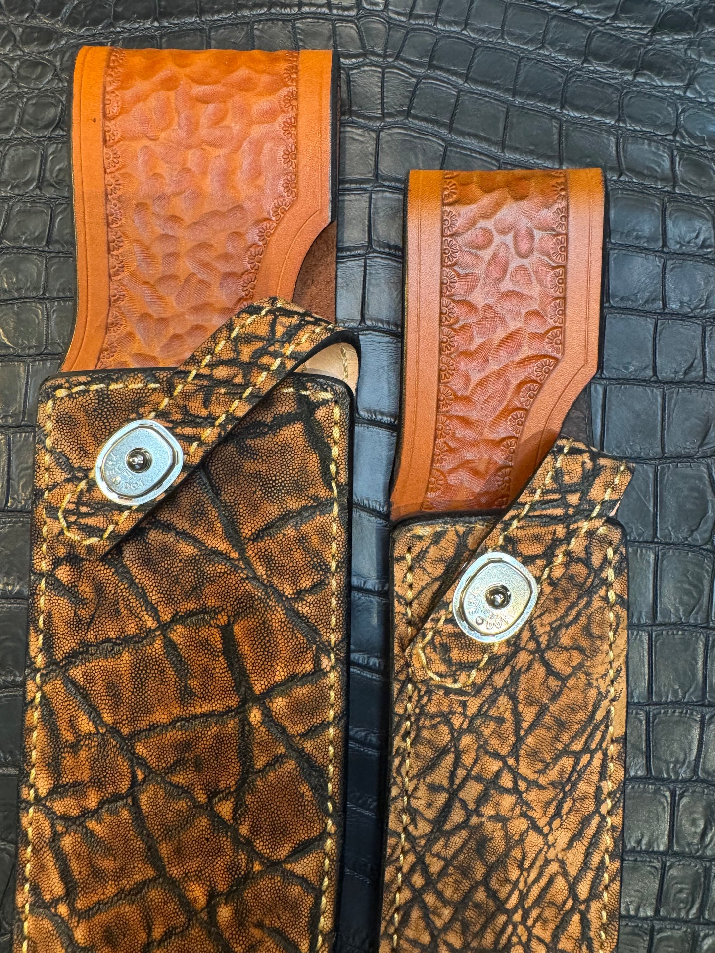 A pair of Randall Model 12-11 Large Sasquatch and Randall Model 12-8 Small Sasquatch Sheaths in Exotic Cognac Elephant by Treeman.