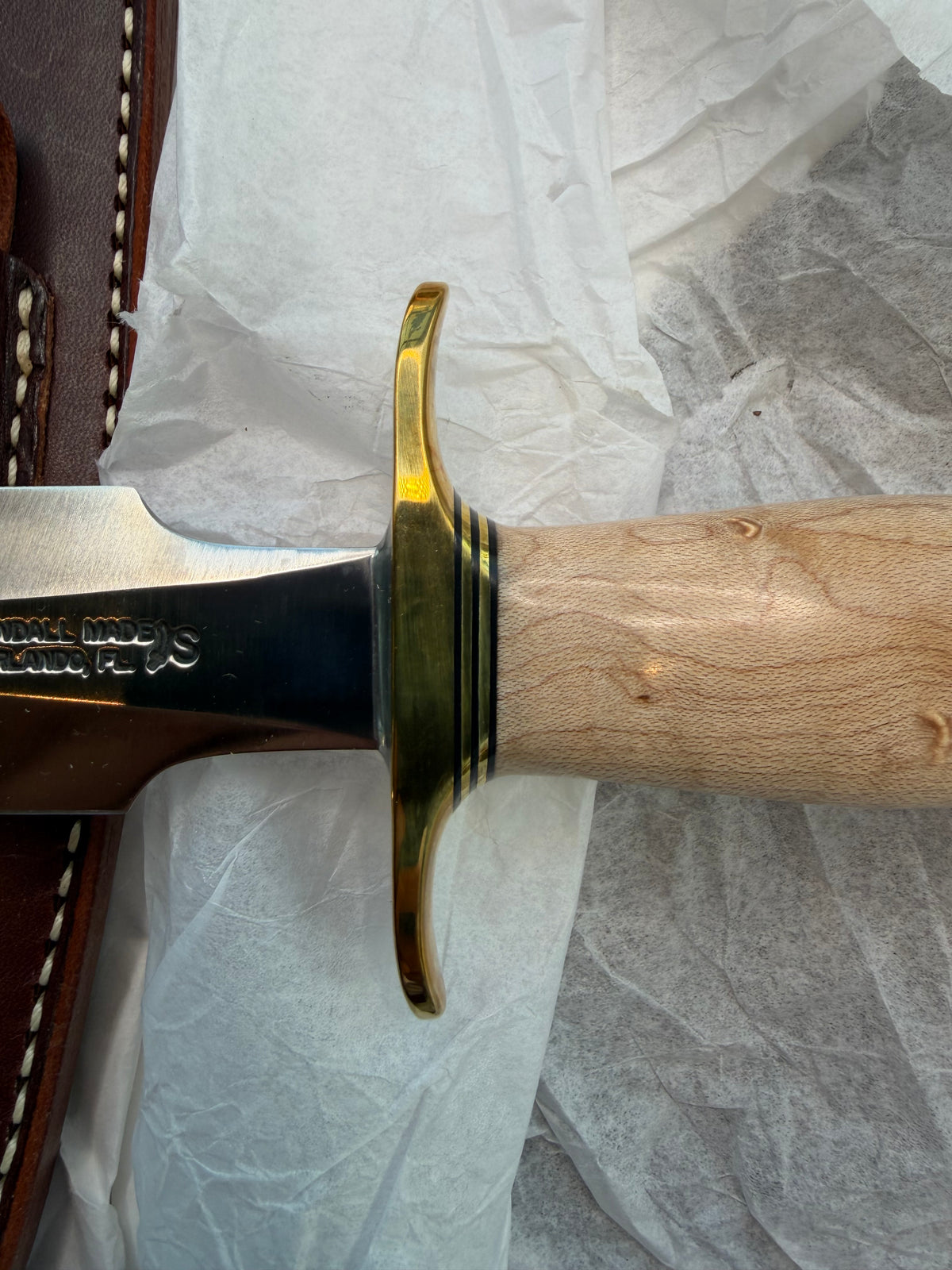 New in Paper Randall Made Knife Model 2-7 Maple wood, Stainless, Black and gold spacers, Brass Hilt and butt cap.