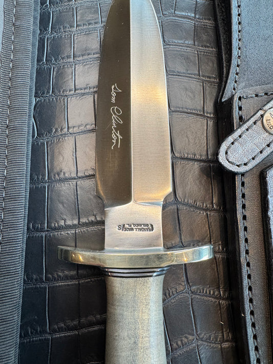 Randall Tom Clinton Dealer Special. Clinton Blade etched Commemorative 1/100 in a nice piece of Walnut. Very cool matching Elephant Gutcher sheath. Nickel Silver Hilt and Aluminum Coolie Butt cap. Included in black facsimile Tom Clinton case.
