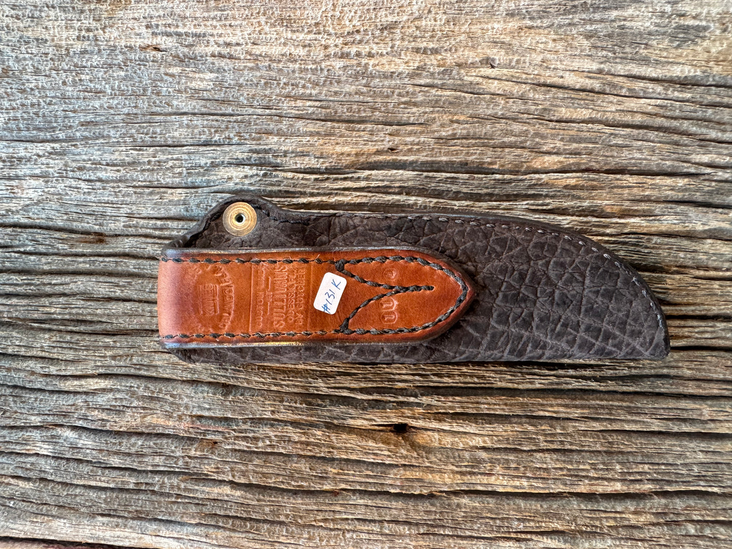 Randall Model 11-4 Sheath in Exotic faded Black Hippo. Snap closure over the hilt , belt loop on the back versus on top. (very rare) Custom Made at Sullivan’s by Gutcher.