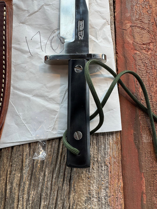 New in Paper Randall Model 17-5.5 Astro knife is a custom, handmade combat knife with a 5.5" stainless steel clip point blade and a brown leather sheath. Full tang design, black handle.