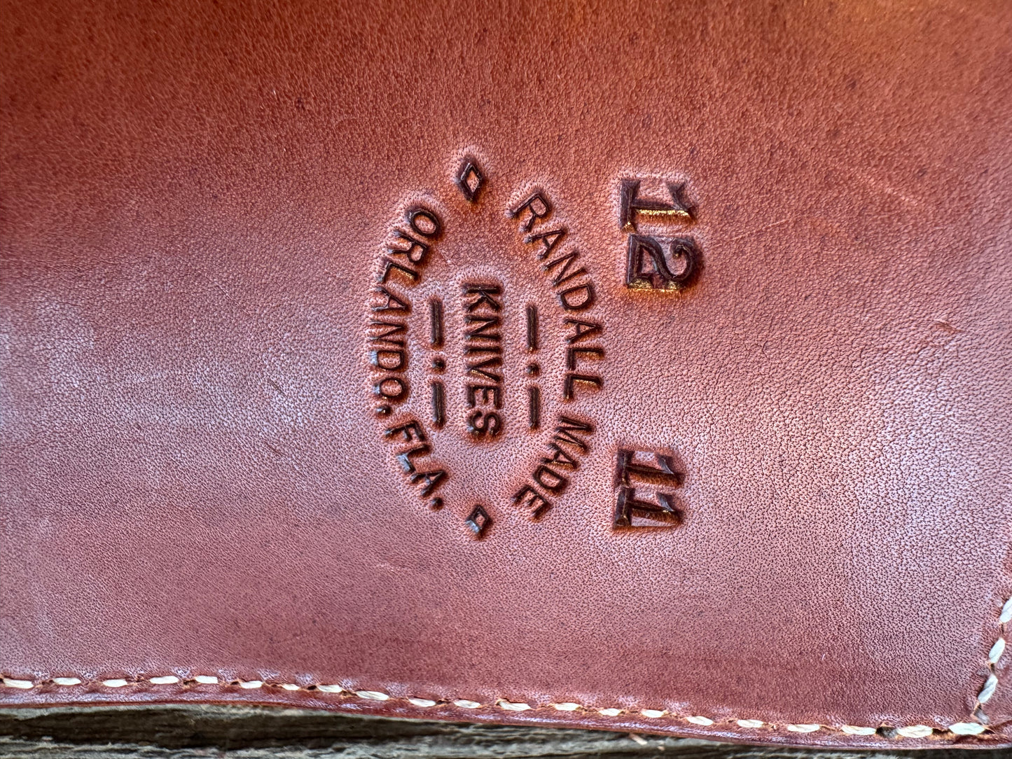 Model 12-11 Smithsonian Bowie. Leather stacked handle with a Brass lugged hilt. Green and white spacers.