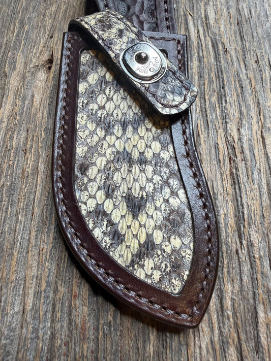 Randall Model Bowles Special sheath with an Eastern Diamondback RattleSnake skin from Treeman Sheaths. Hand tooled belt loop, canteen snap. Vibrant colors and one of the hardest skins to source.