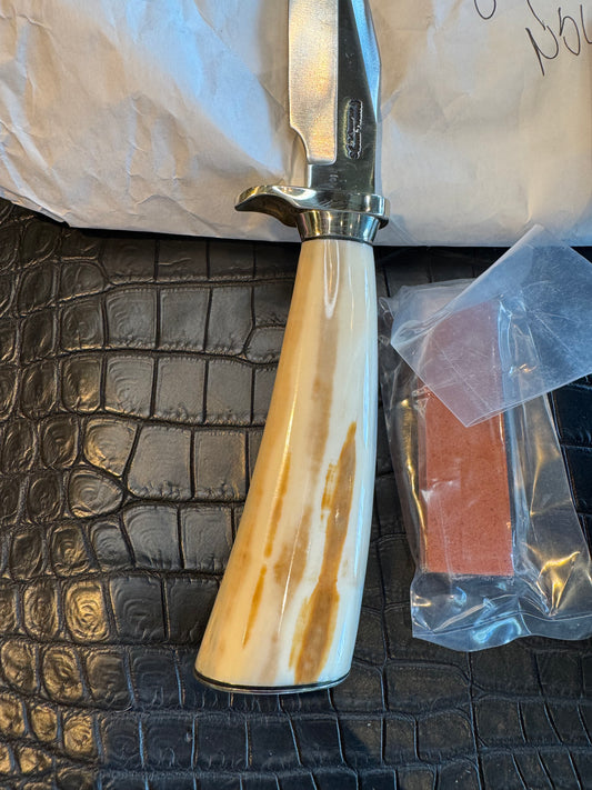 News in Paper Randall Model 8-4 in a gorgeous piece of Cream and Blue Fossil Walrus Ivory. Nickel Silver single hilt with a nickel Collar and butt cap.