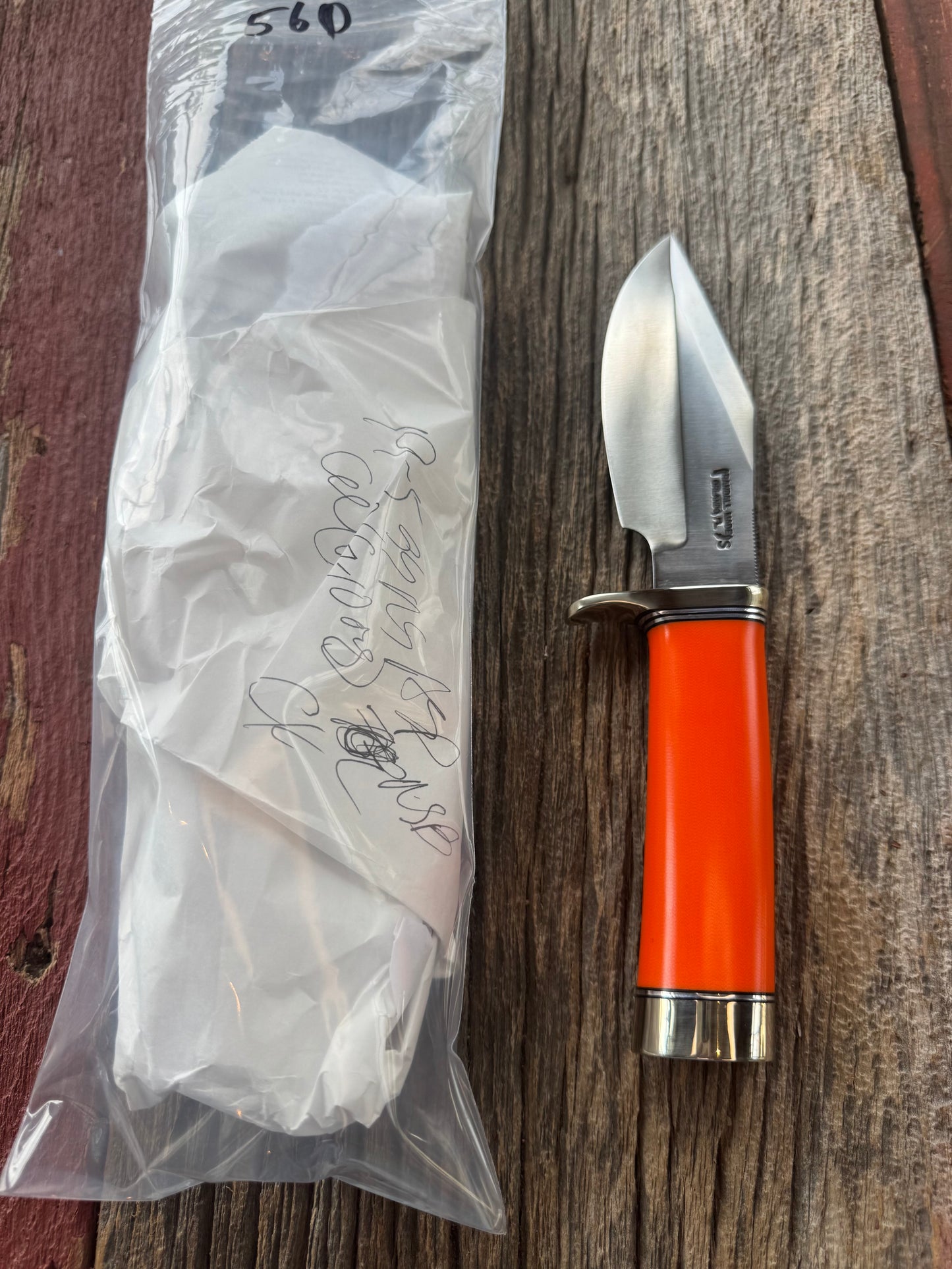 New in paper Randall Model 19-5 with a nice piece of customer supplied Orange G10. Stainless Steel, Nickel Silver Hilt and Butt cap.