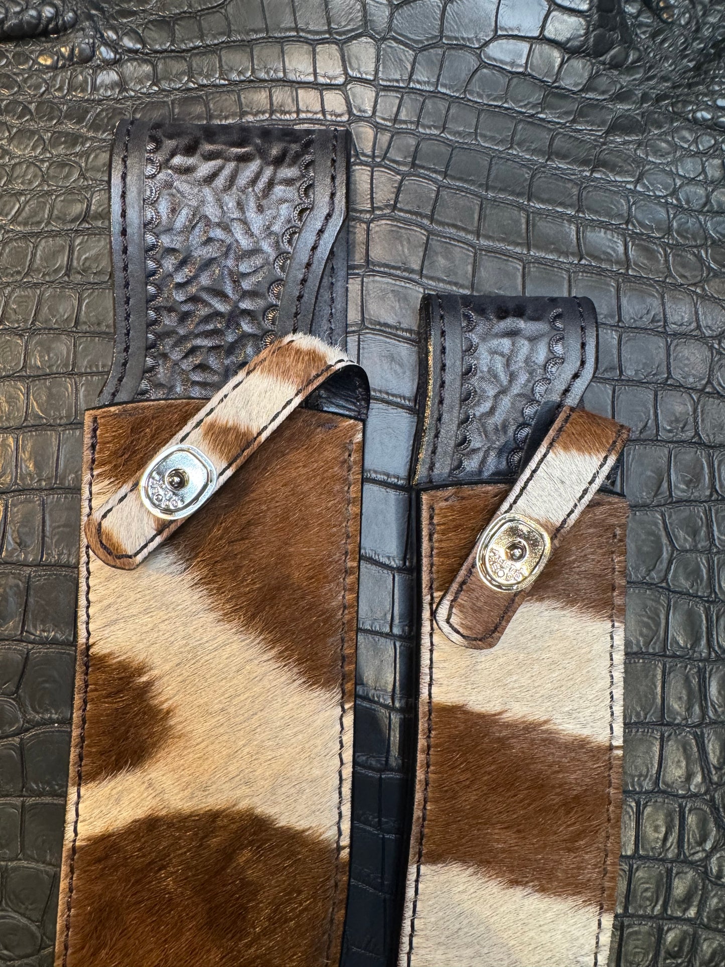 A pair of Randall Model 12-11 Large Sasquatch and Randall Model 12-8 Small Sasquatch Sheaths in Exotic Zebra by Treeman.