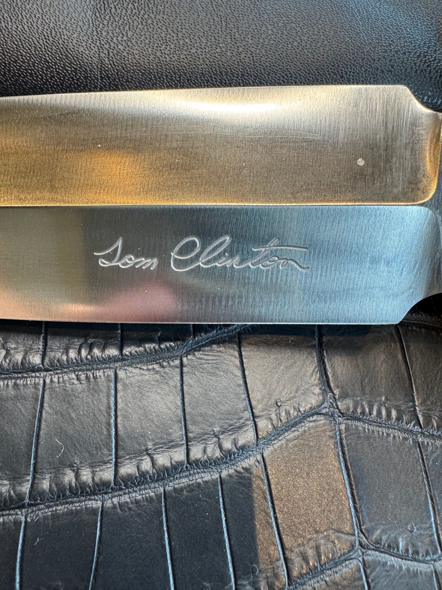Randall Tom Clinton Dealer Special. Clinton Blade etched Commemorative 1/100 in a nice piece of finger grooved Ivorite. Very cool Black Crocodile skull Gutcher sheath. Nickel Silver Hilt. Included in black facsimile Tom Clinton case.