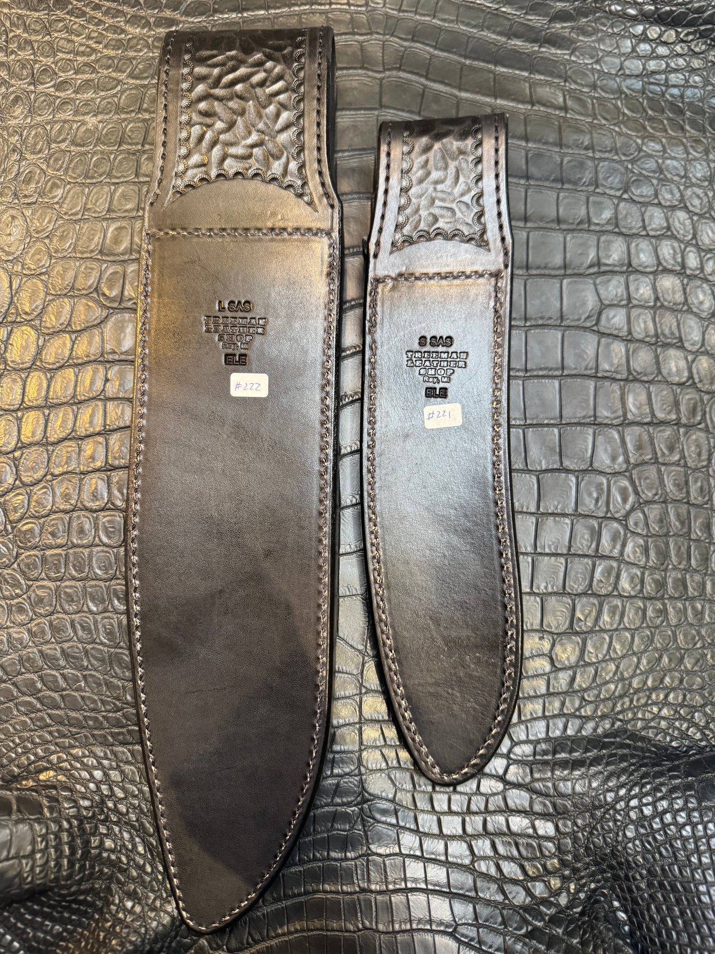 A pair of Randall Model 12-11 Large Sasquatch and Randall Model 12-8 Small Sasquatch Sheaths in Exotic Black Elephant by Treeman.
