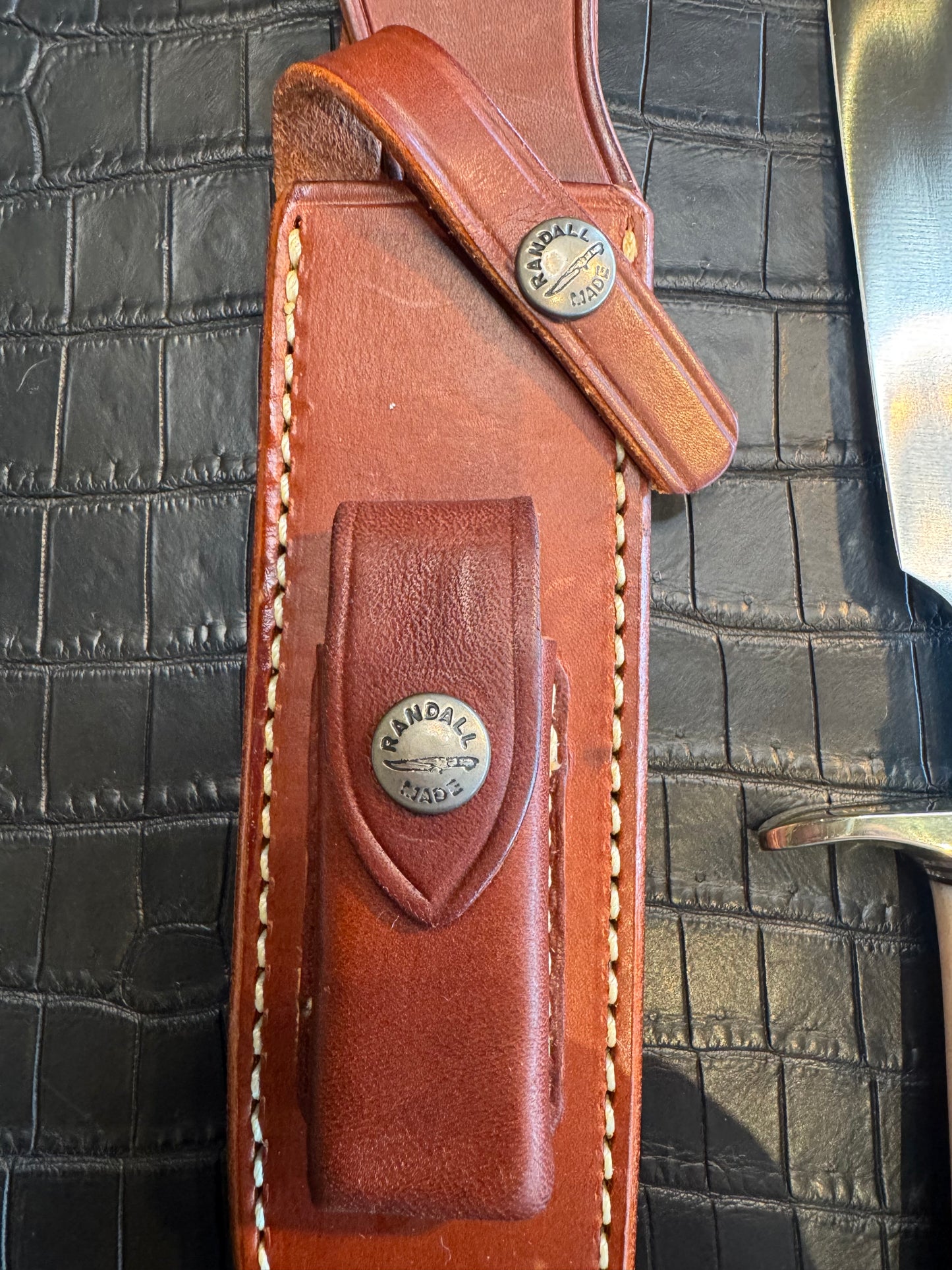 Randall Model 1-7 in a gorgeous beefy piece of Creamy Fossil Walrus Ivory. Nickel Silver Hilt and butt cap.