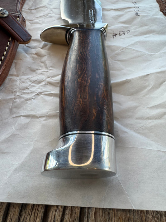 New in Paper Randall Model 19-5 Bushmaster with an Ironwood handle. SS blade, Nickel silver single hilt. Brown leather sheath.