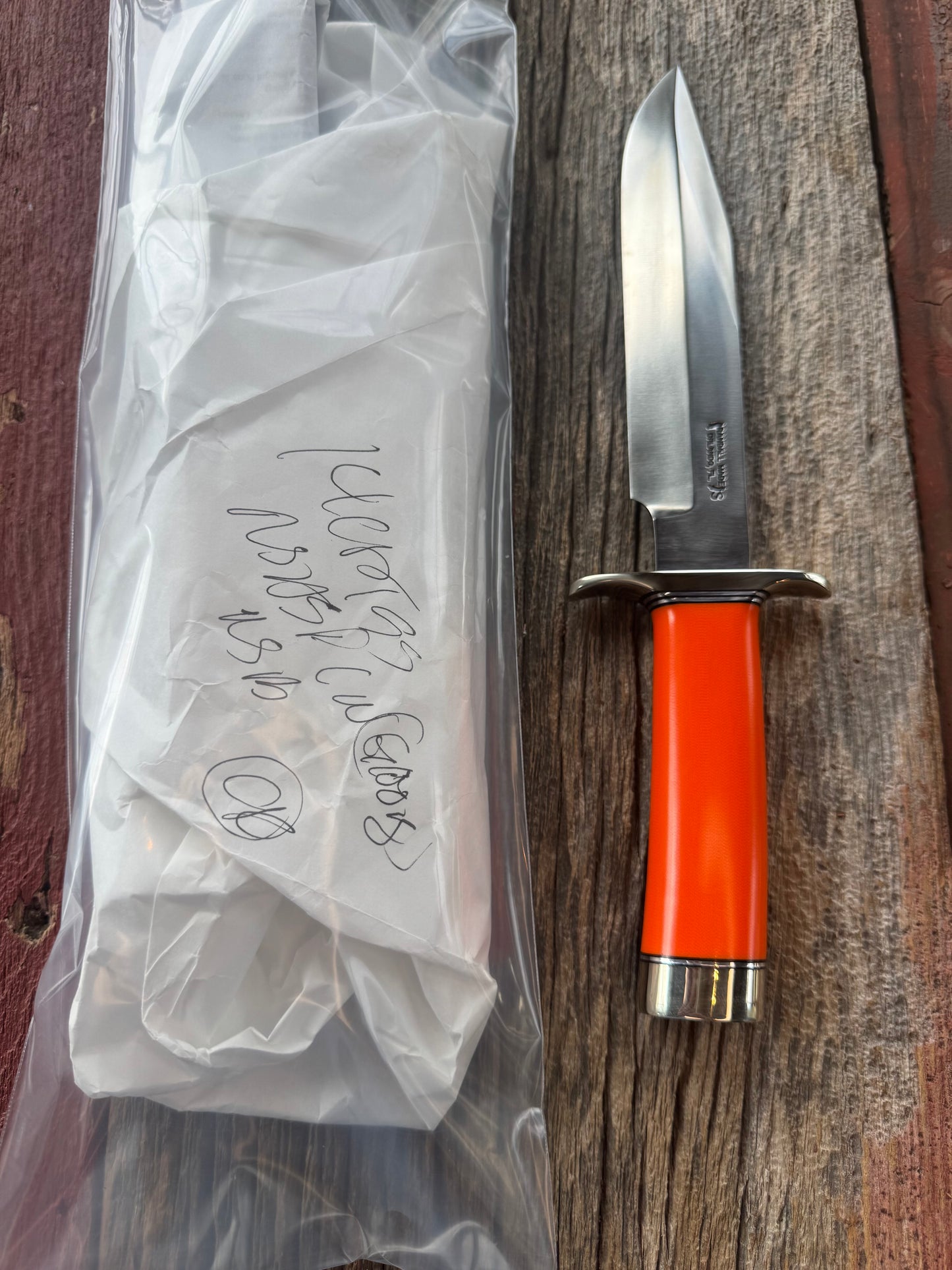 New in paper Randall Model 14 CDT with a nice piece of customer supplied Orange G10. Stainless Steel, Nickel Silver Hilt and Butt cap.