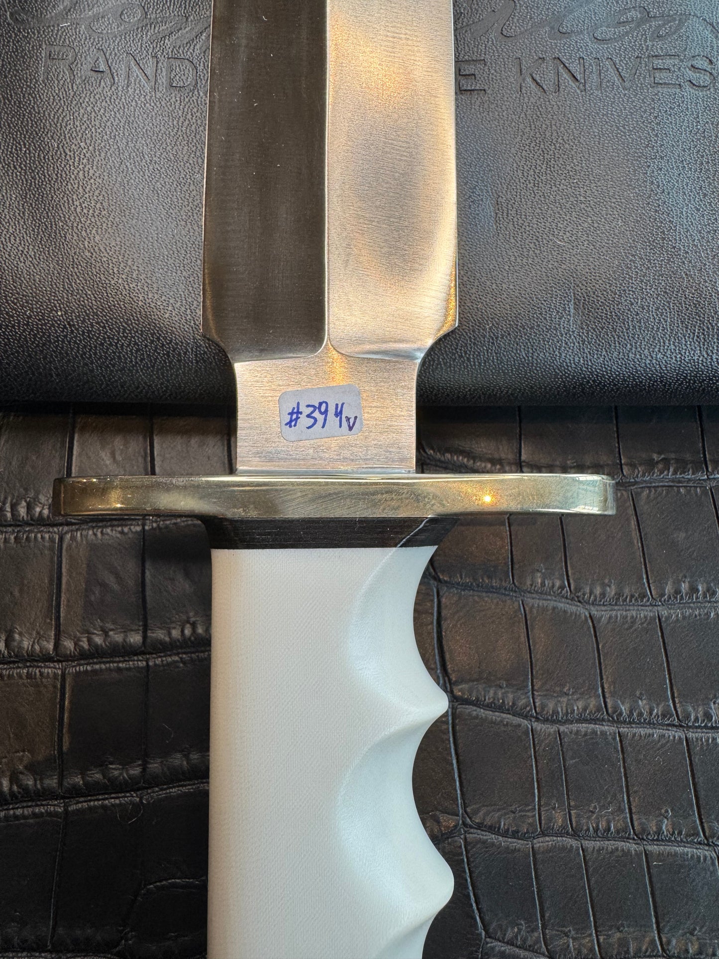 Randall Tom Clinton Dealer Special. Clinton Blade etched Commemorative 1/100 in a nice piece of finger grooved Ivorite. Very cool Black Crocodile skull Gutcher sheath. Nickel Silver Hilt. Included in black facsimile Tom Clinton case.