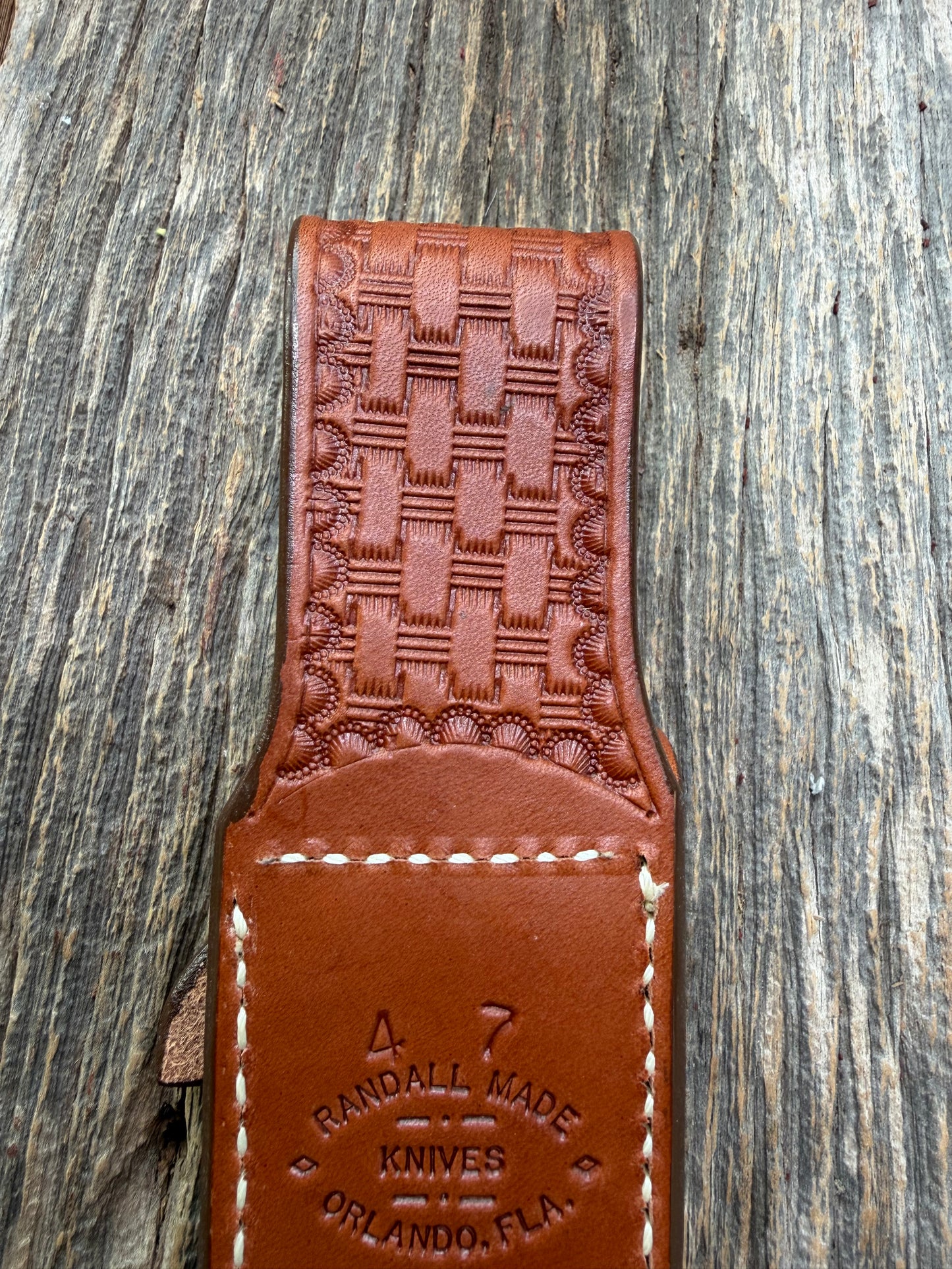 Pristine Randall Model 4-7 sheath in Exotic Cape Buffalo leather from Sullivans by Gutcher. Heavily tooled belt loop and strap. Randall snap and clean stamping on the back … perfect!!