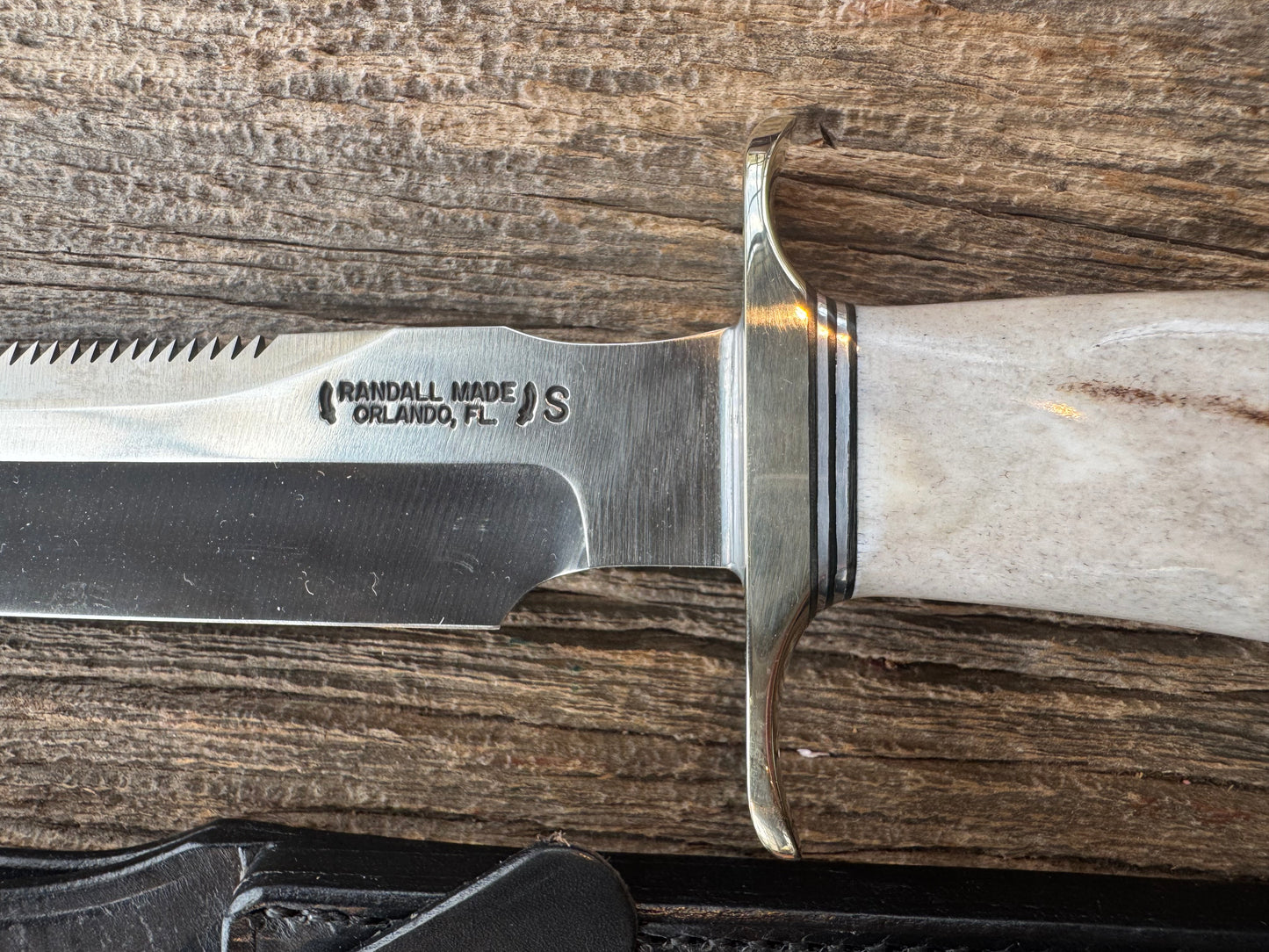 Randall Model 1-7 in a gorgeous piece of Polished Crown Stag. Nickel Silver Hilt, sawteeth and a natural exposed end, Stainless steel.