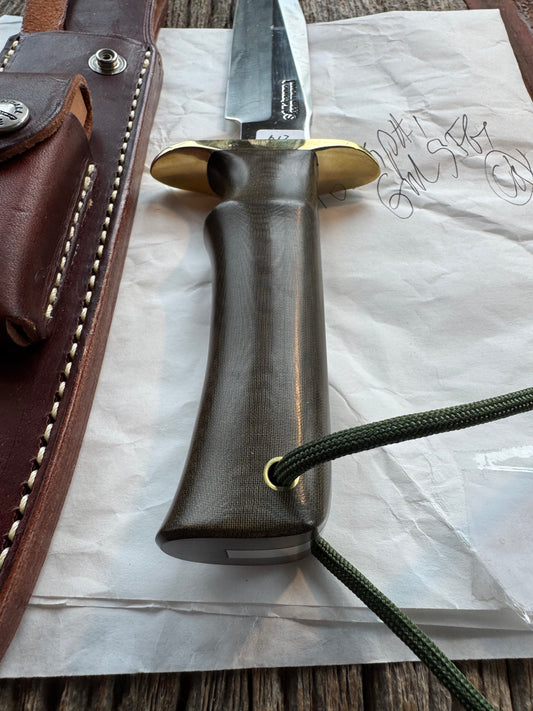 New in Paper Randall Model 16 SP#1 Special fighter with a Green Micarta handle. SS blade, Brass hilt. Lanyard. Brown leather sheath.