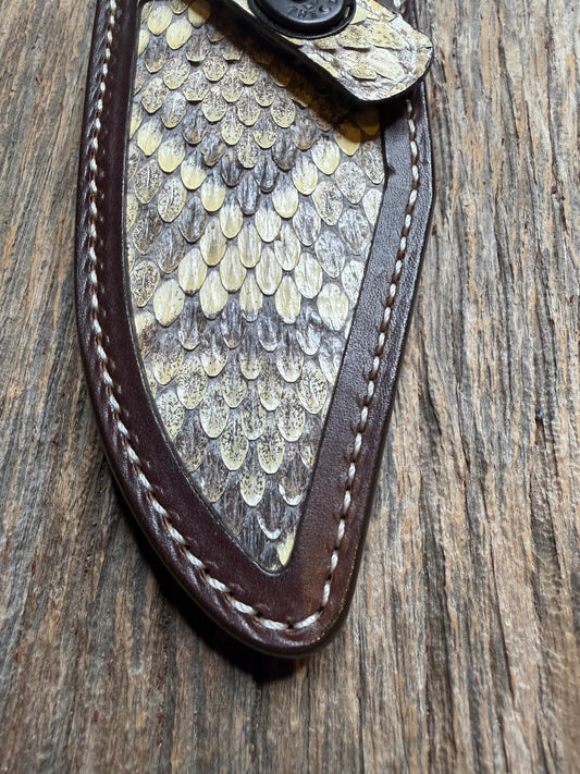 Randall Model 19-5 sheath with an Eastern Diamondback RattleSnake skin from Treeman Sheaths. Hand tooled belt loop, canteen snap. One the hardest skins to source.