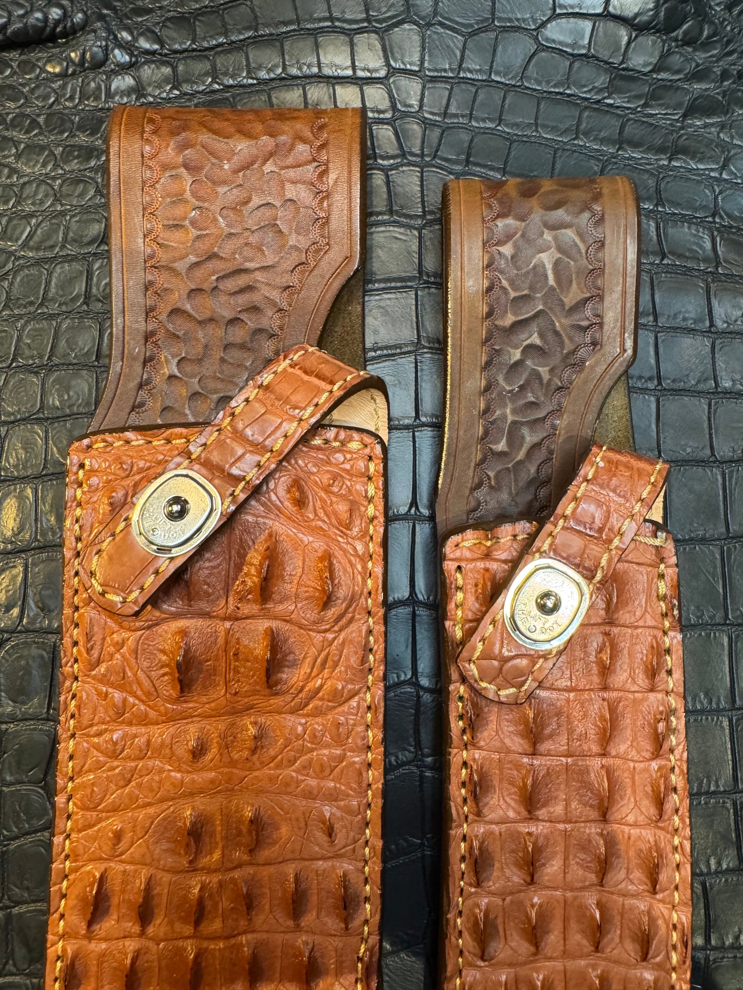 A pair of Randall Model 12-11 Large Sasquatch (Skull) and Randall Model 12-8 Small Sasquatch ( middle back) Sheaths in Exotic Tan Hornback Crocodile by Treeman.