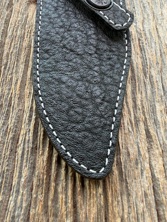 New Randall Model 19-5 Sheath in Exotic thick and textured Black Elephant hide on black leather from Treeman with a black Canteen snap. Hand tooled belt loop. Killer sheath.