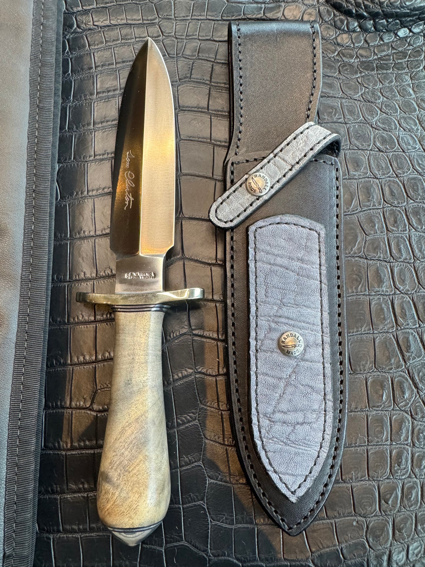 Randall Tom Clinton Dealer Special. Clinton Blade etched Commemorative 1/100 in a nice piece of Walnut. Very cool matching Elephant Gutcher sheath. Nickel Silver Hilt and Aluminum Coolie Butt cap. Included in black facsimile Tom Clinton case.