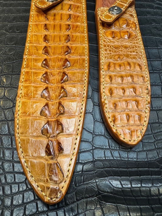 A pair of Randall Model 12-11 Large Sasquatch (Tail) and Randall Model 12-8 Small Sasquatch (Skull) Sheaths in Exotic Tan Hornback Crocodile by Treeman.