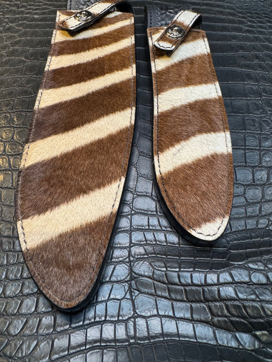 A pair of Randall Model 12-11 Large Sasquatch and Randall Model 12-8 Small Sasquatch Sheaths in Exotic Zebra by Treeman.