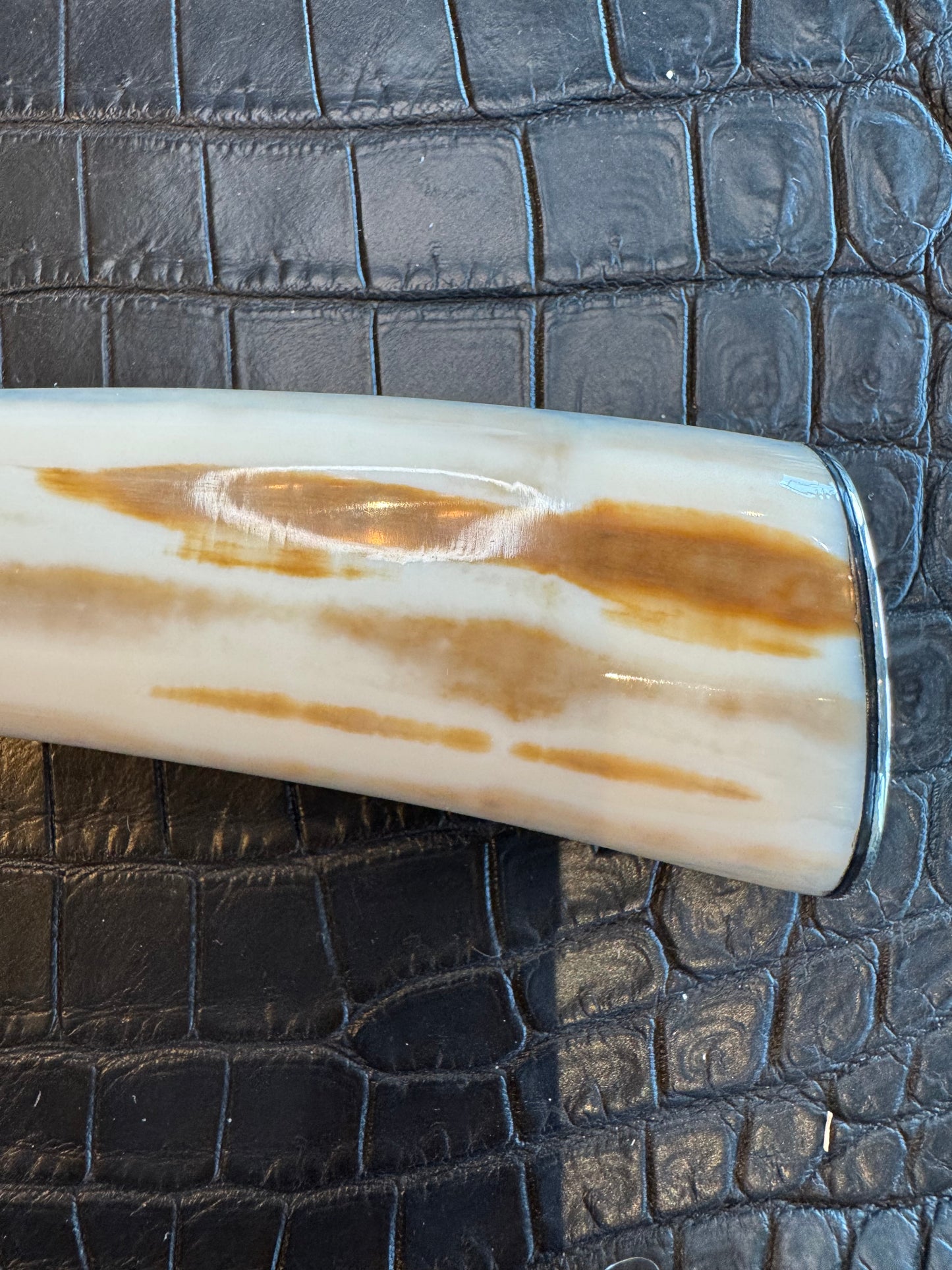 News in Paper Randall Model 8-4 in a gorgeous piece of Cream and Blue Fossil Walrus Ivory. Nickel Silver single hilt with a nickel Collar and butt cap.