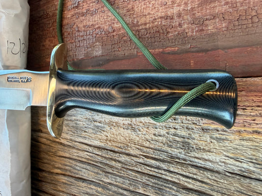 New in Paper Randall Model 16 SP#1 Special fighter with a Black Micarta handle. SS blade, Nickel silver Straight hilt. Lanyard. Brown leather sheath.