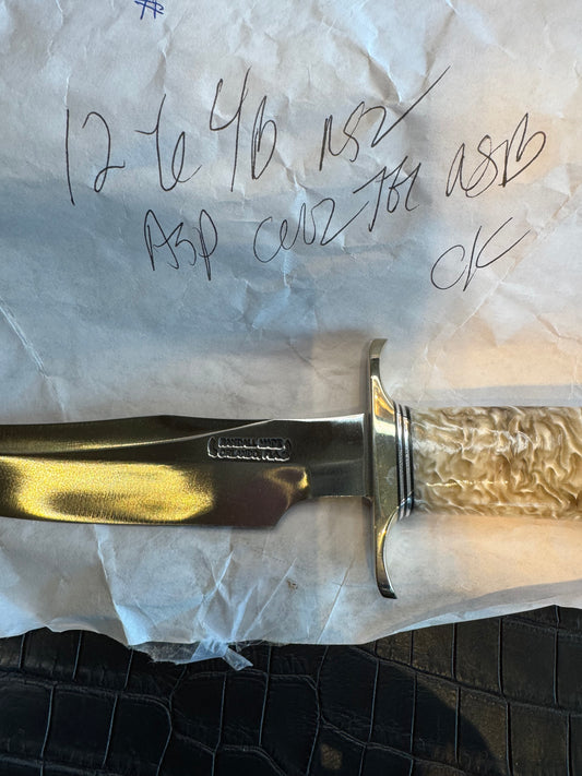 In Paper Randall Model 12-6 in Musk Ox. Lead Bullet Fragment embedded in the Musk ox. Nickel Silver Hilt and butt cap.