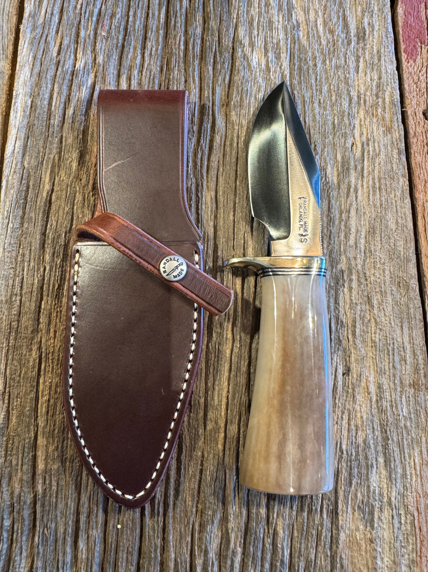 Randall Model 19-4 in Beautiful Fossil Walrus Ivory. Gorgeous colors and very rare to see a 19 in FWI. Nickel Silver Single Hilt and natural end, SS, and Flawless