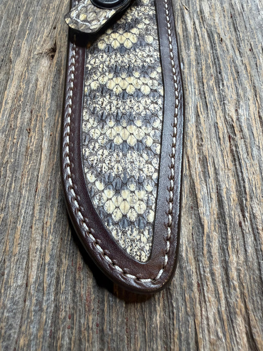 Randall Model 1-6 sheath with an Eastern Diamondback RattleSnake skin from Treeman Sheaths. Hand tooled belt loop, canteen snap. Vibrant colors and one of the hardest skins to source.