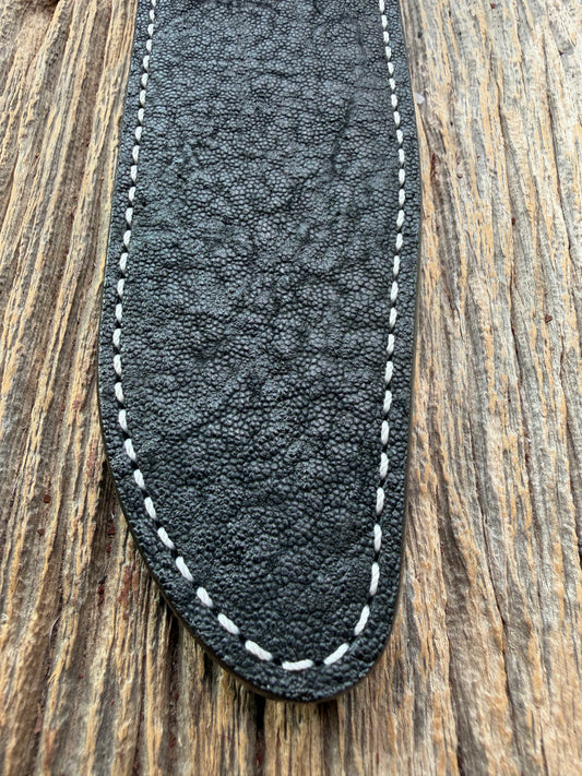 New Randall Model 1-7 Sheath in Exotic thick and textured Black Elephant hide on black leather from Treeman with a black Canteen snap. Hand tooled belt loop. Killer sheath.