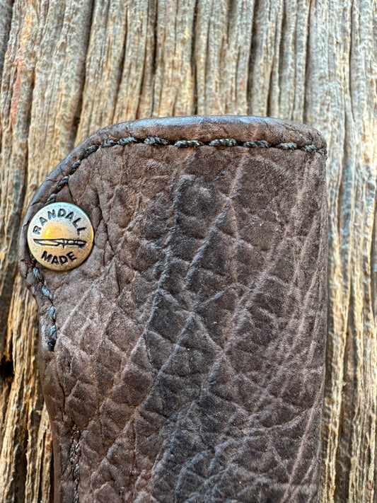 Randall Model 11-4 Sheath in Exotic faded Black Hippo. Snap closure over the hilt , belt loop on the back versus on top. (very rare) Custom Made at Sullivan’s by Gutcher.