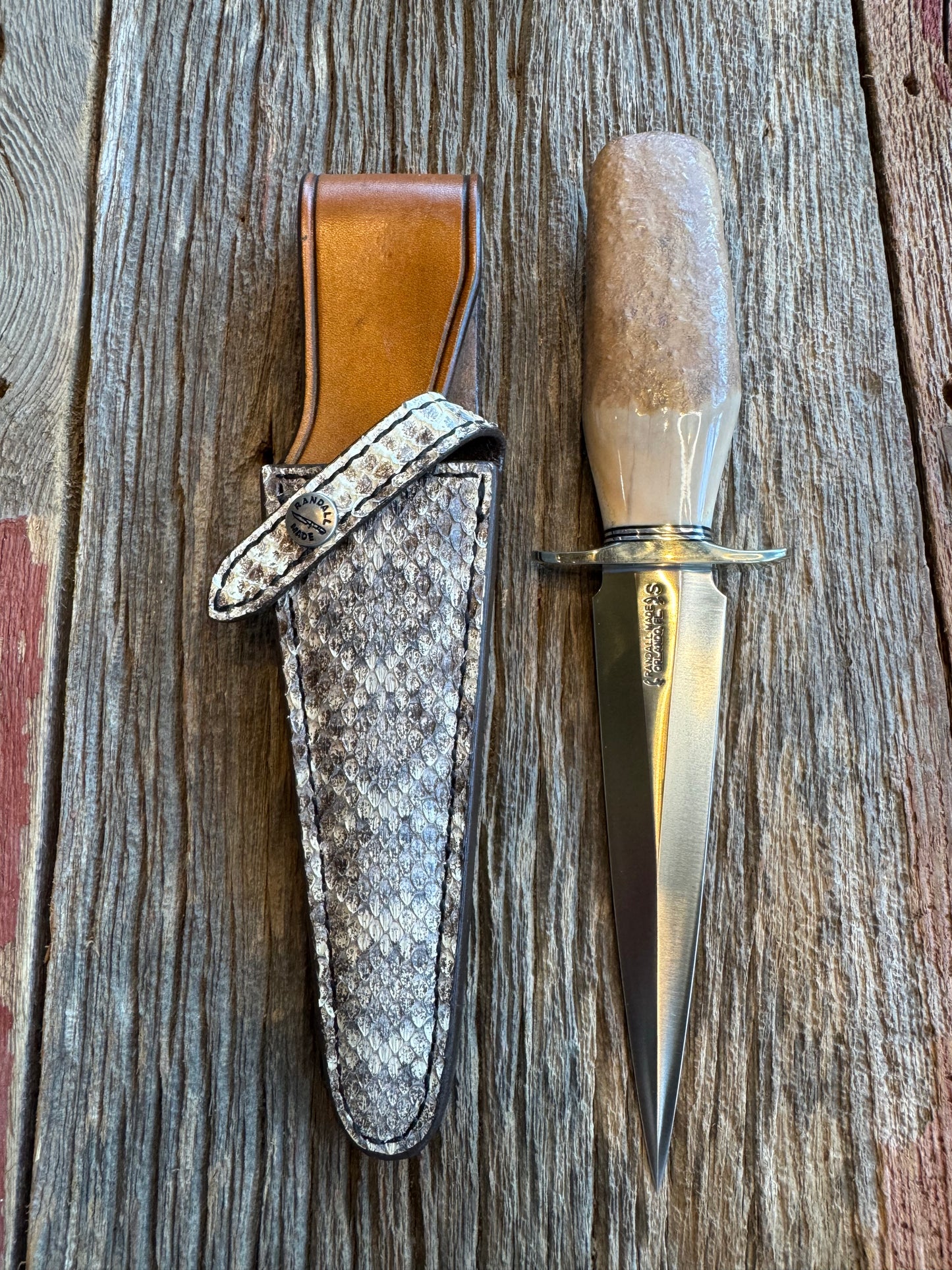 Randall Knife Model 13-6 Small Arkansas Toothpick Artifact. Fossil Walrus in an Ice Ax Handle. Included is a very rare Gutcher Rattlesnake sheath, Stainless Steel.
