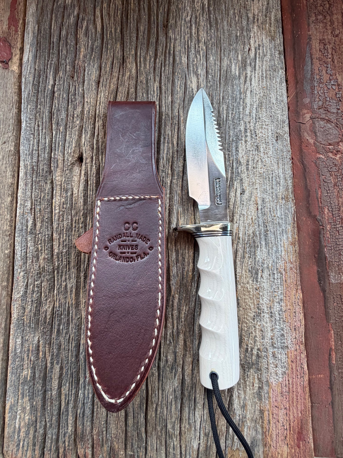 Randall Model Combat Companion with a nice piece of customer supplied Warthers Resin with finger grooves. Teeth, Nickel Silver Hilt and a raw natural end.