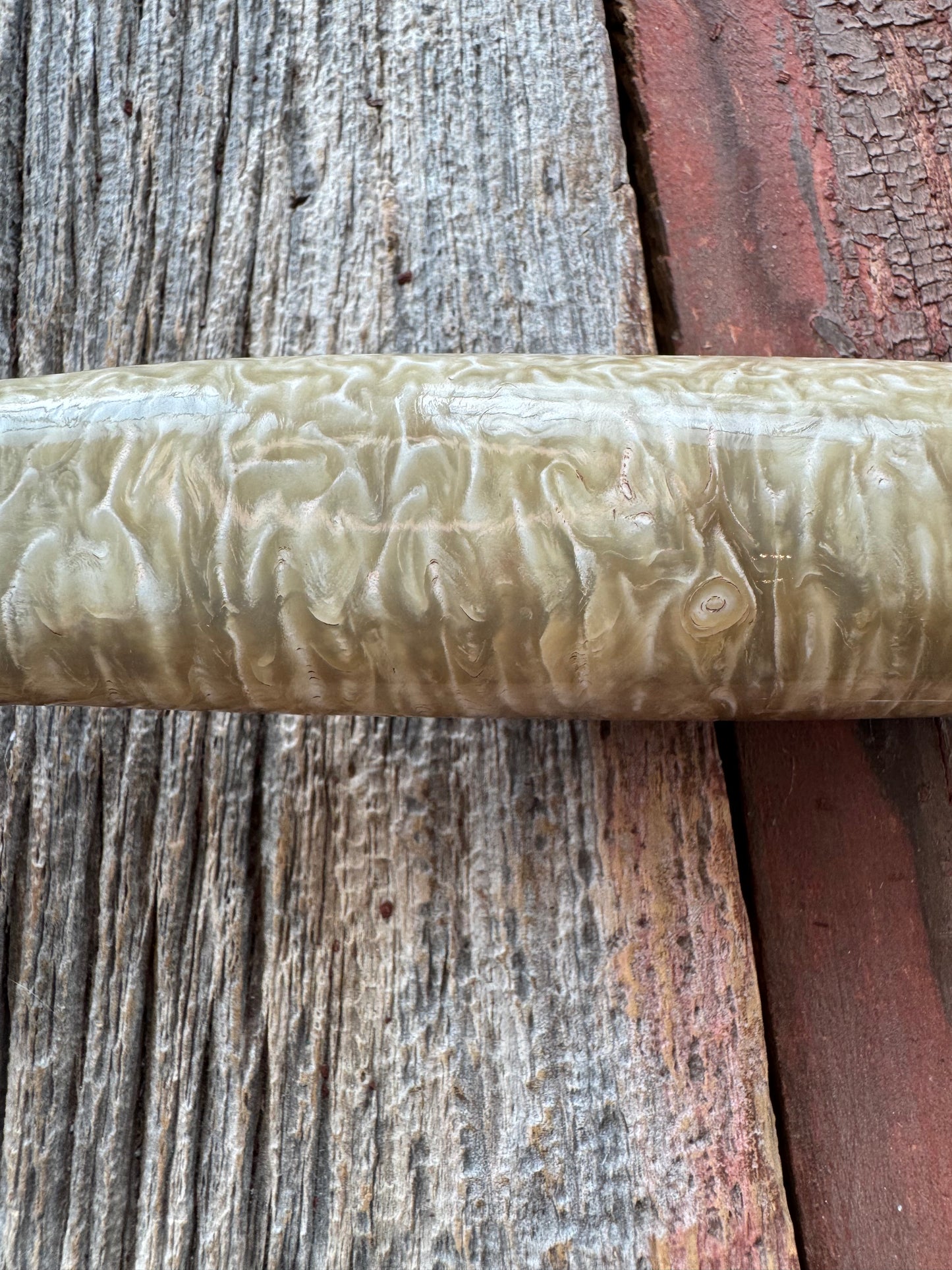 Randall Model 12-6 in Musk Ox. Natural raw end. Nickel Silver Single Hilt and Black and Aluminum spacers, stainless steel blade.