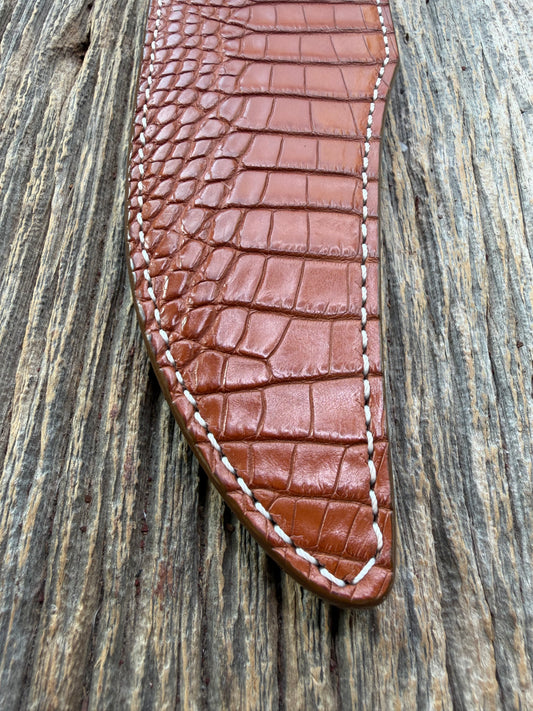 New Randall Model 12-8 Big Bear Sheath in Exotic thick and textured Honey Crocodile skin on brown leather from Treeman with a silver Canteen snap. Hand tooled belt loop. Killer sheath.