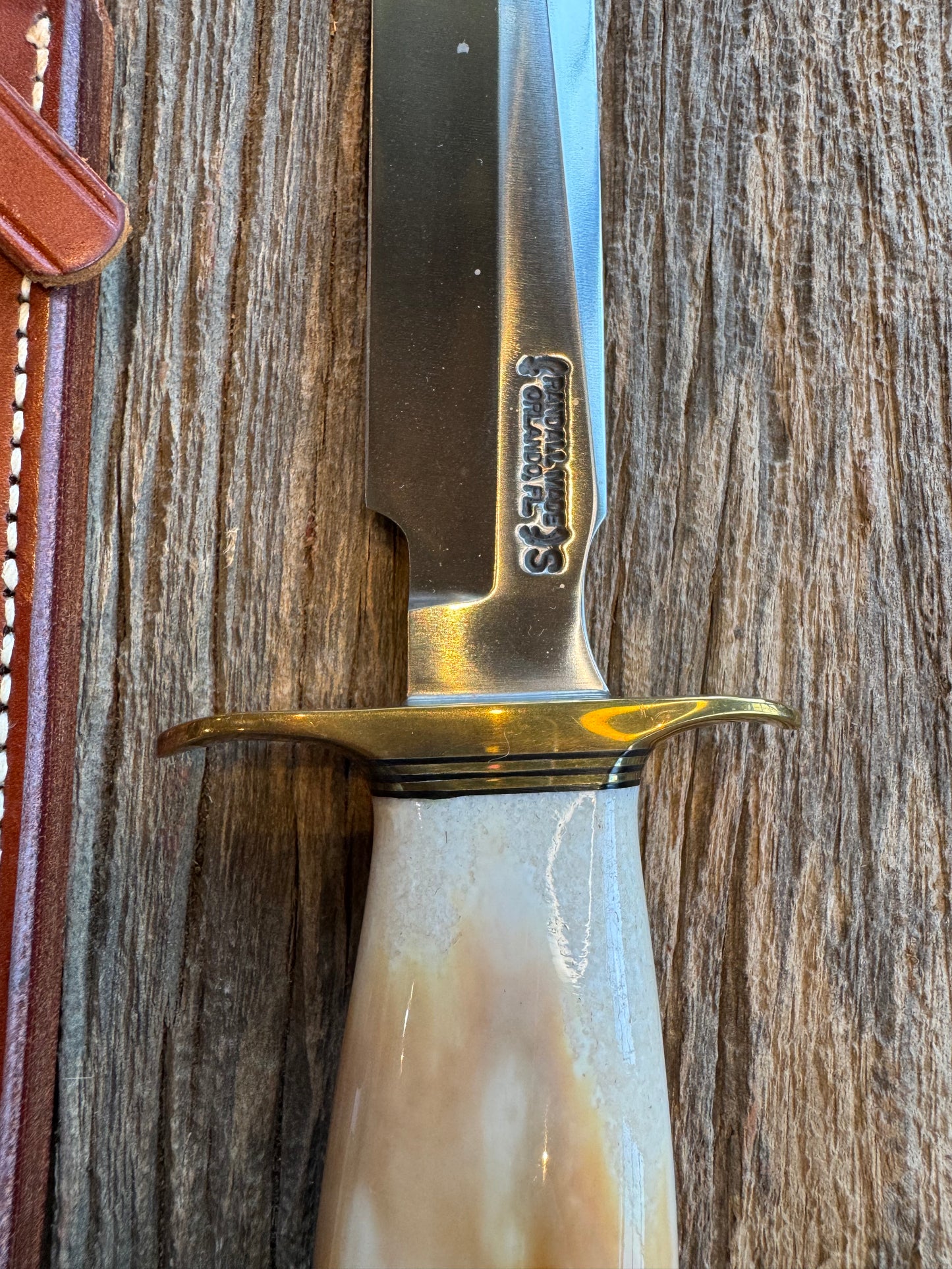 Randall Knife Model 1-8 Creamy Fossil Walrus Handle. From the Jim Gates Collection via Rick Bowles. Stainless Steel, Brass Hilt and butt plate.