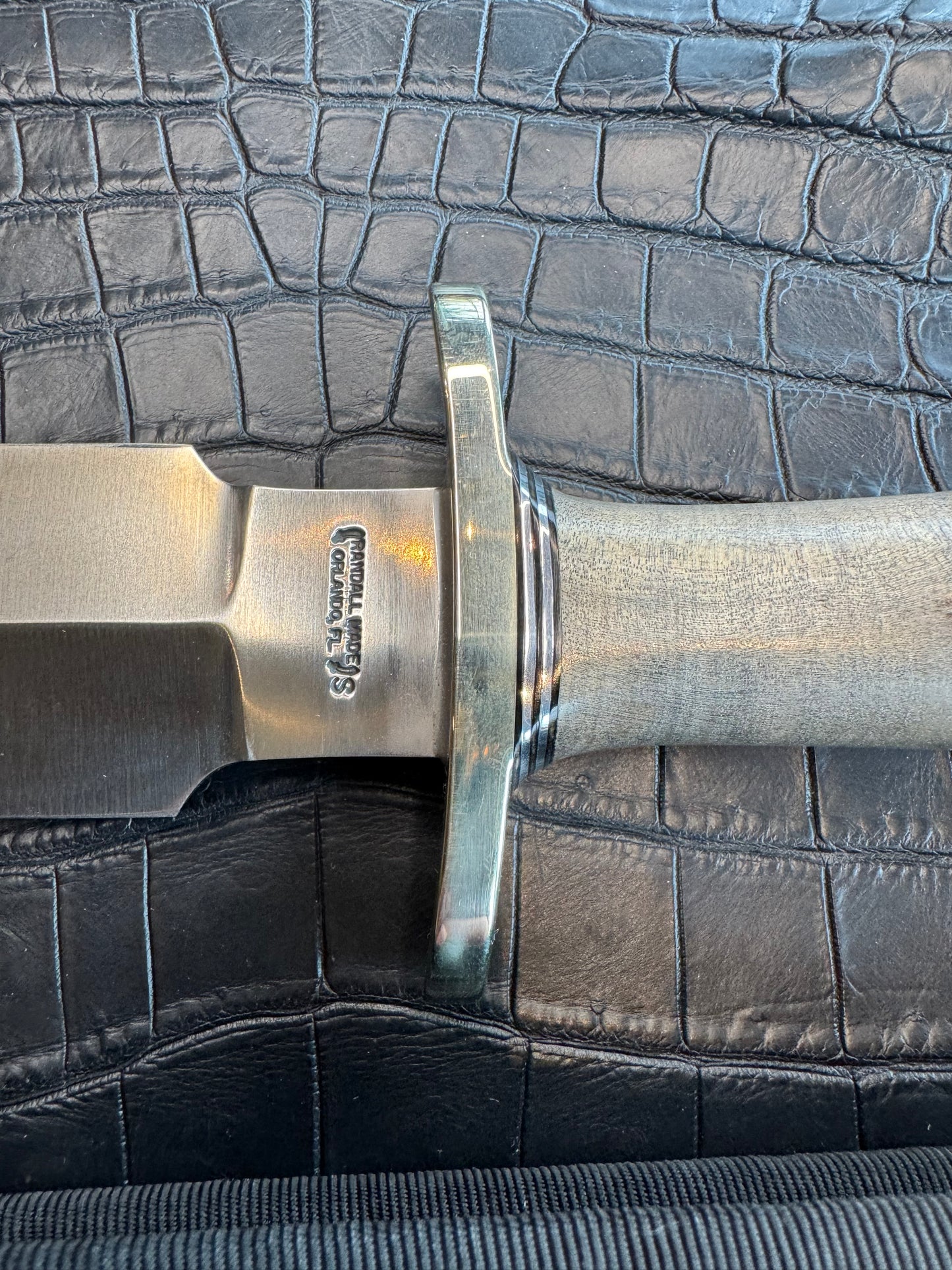 Randall Tom Clinton Dealer Special. Clinton Blade etched Commemorative 1/100 in a nice piece of Walnut. Very cool matching Elephant Gutcher sheath. Nickel Silver Hilt and Aluminum Coolie Butt cap. Included in black facsimile Tom Clinton case.