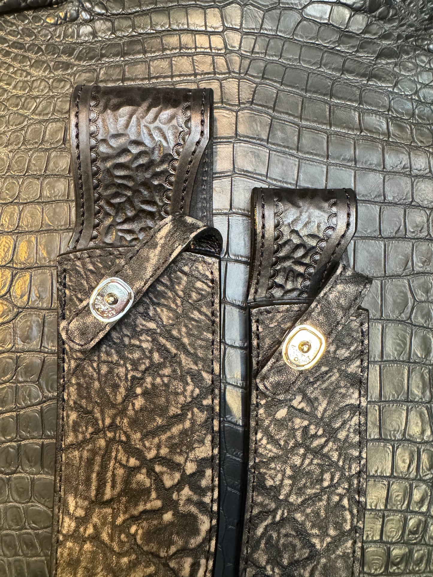A pair of Randall Model 12-11 Large Sasquatch and Randall Model 12-8 Small Sasquatch Sheaths in Exotic Black Elephant by Treeman.