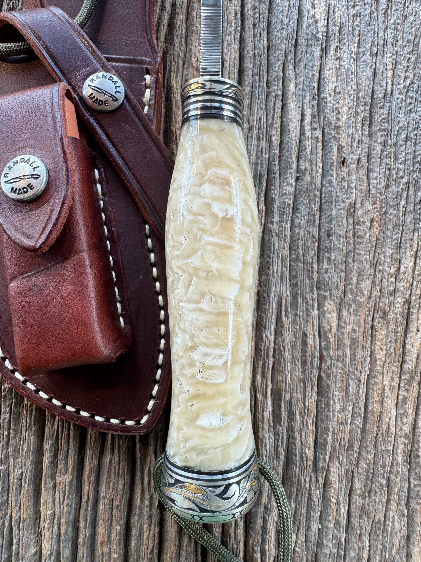 Randall Model Bowles Skinner Dealer Special Knife, perfect Musk Ox. This knife is a one of 4 per Rick Bowles. Beautifully engraved by Jere Davidson and adorned with gold and silver inlays.