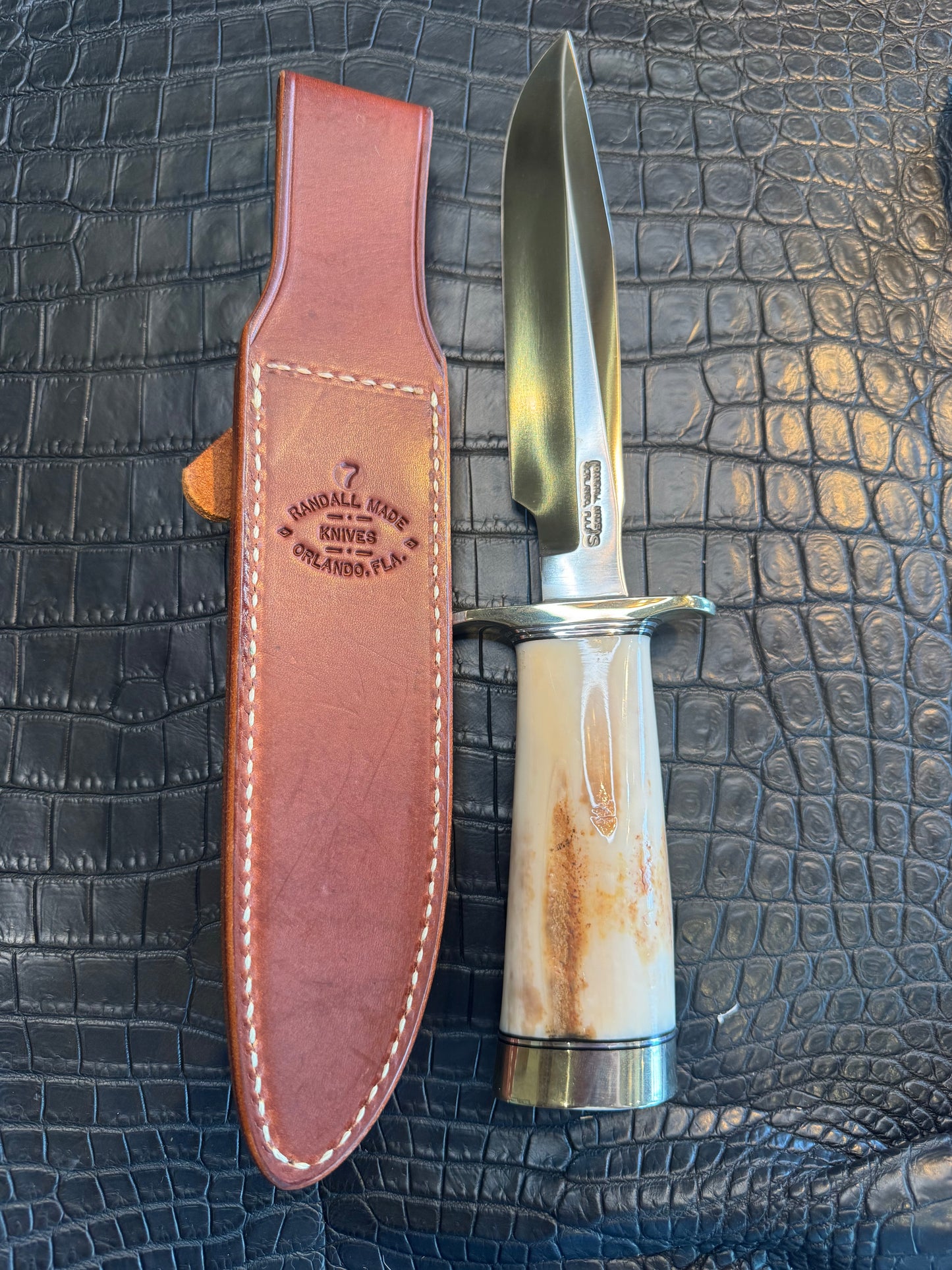 Randall Model 1-7 in a gorgeous beefy piece of Creamy Fossil Walrus Ivory. Nickel Silver Hilt and butt cap.
