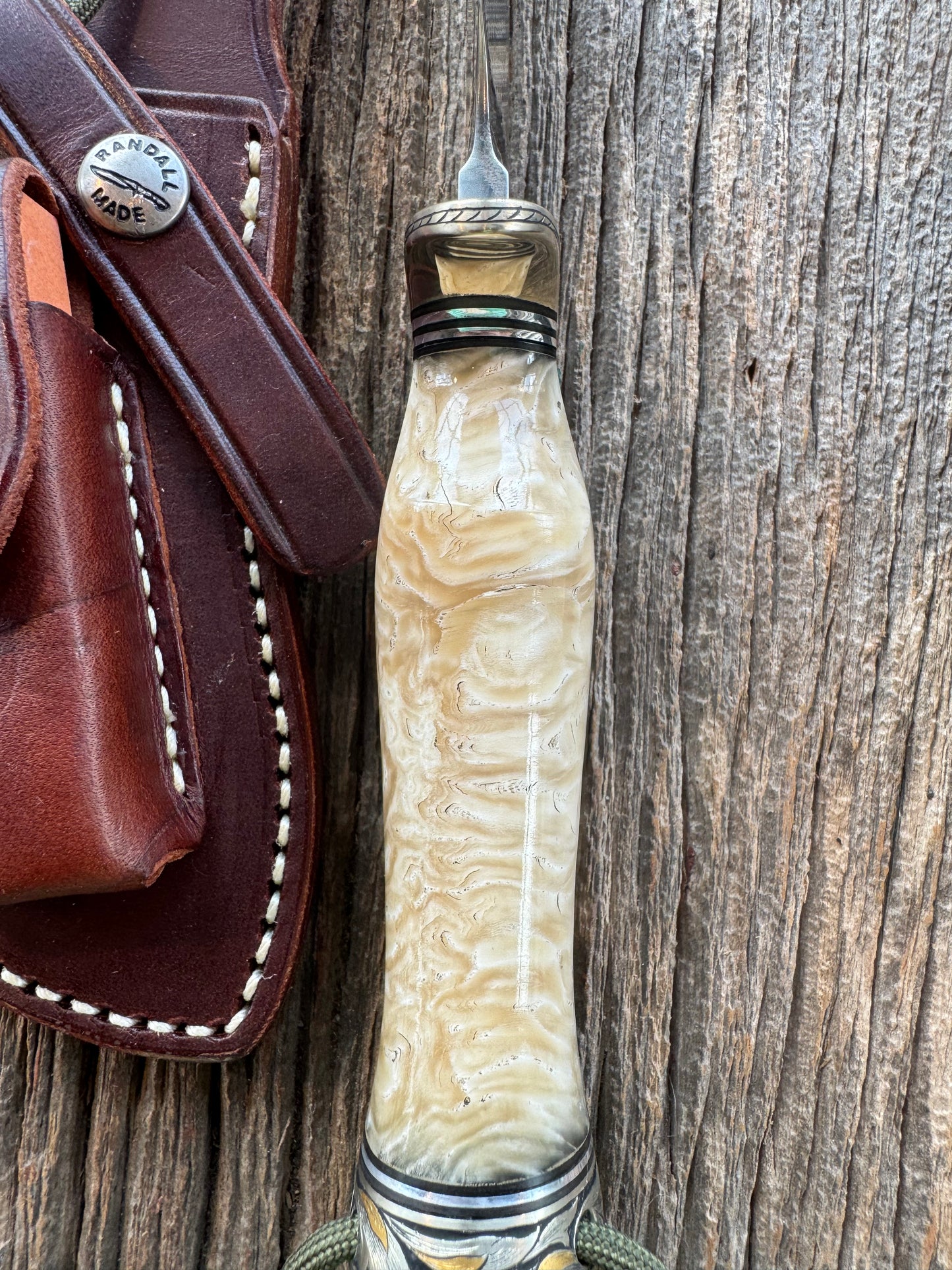 Randall Model Bowles Skinner Dealer Special Knife, perfect Musk Ox. This knife is a one of 4 per Rick Bowles. Beautifully engraved by Jere Davidson and adorned with gold and silver inlays.
