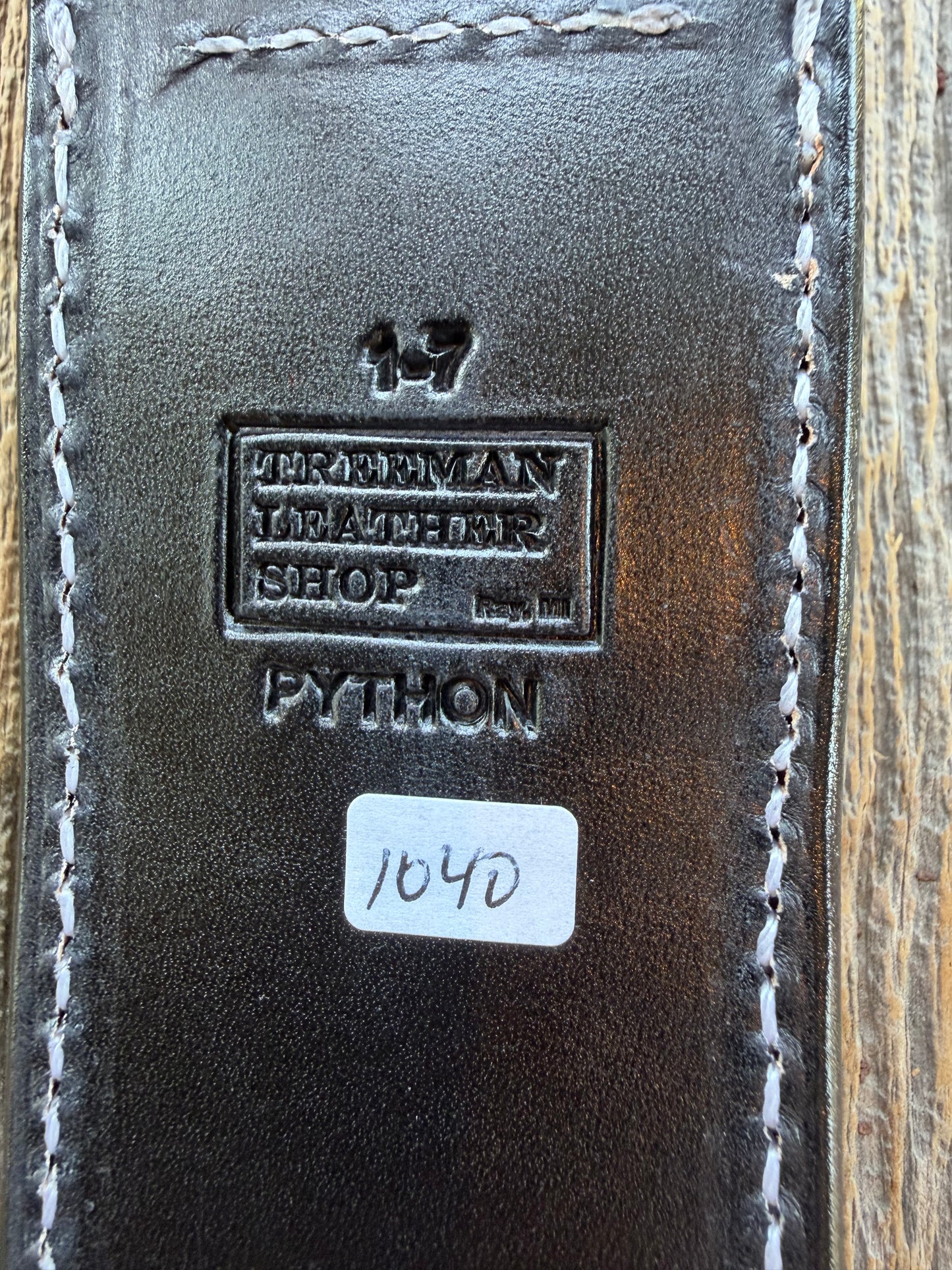 New Randall Model 1-7 Sheath in Exotic Brown Python Snake skin on black leather from Treeman with a black Canteen snap. Hand tooled belt loop. Deviated white stitching. Killer sheath.