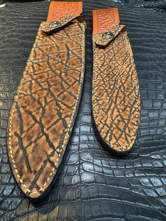 A pair of Randall Model 12-11 Large Sasquatch and Randall Model 12-8 Small Sasquatch Sheaths in Exotic Cognac Elephant by Treeman.